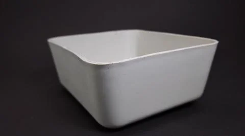 Solid white Plastic Storage Box in square shape, black background. Stock Photos