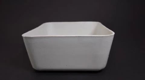 Solid white Plastic Storage Box in square shape, black background. Foto stock