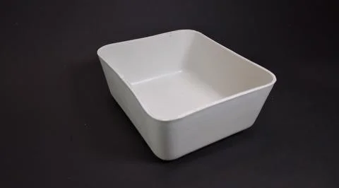 Solid white Plastic Storage Box in square shape, black background. Stock Photos