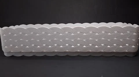 Solid white rectangular Plastic Storage Box, with woven texture, black back.. Stock Photos