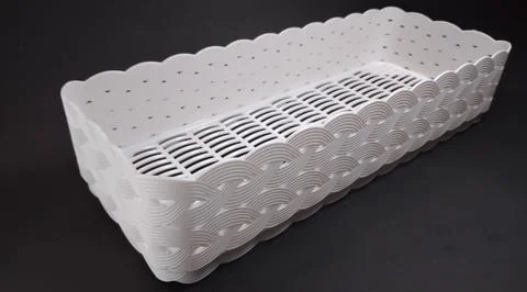 Solid white rectangular Plastic Storage Box, with woven texture, black back.. Stock Photos