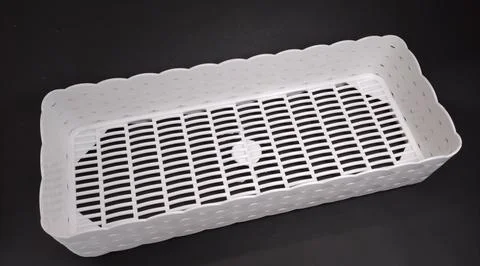 Solid white rectangular Plastic Storage Box, with woven texture, black back.. Stock Photos