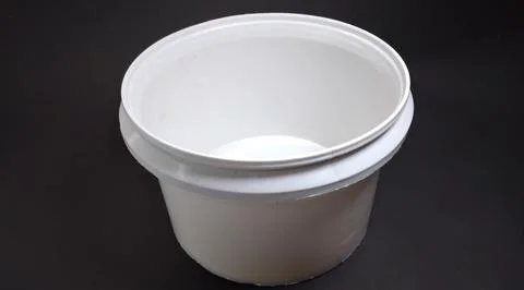 Solid white storage jar, round, black background Foto stock