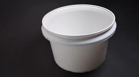 Solid white storage jar, round, black background Stock Photos