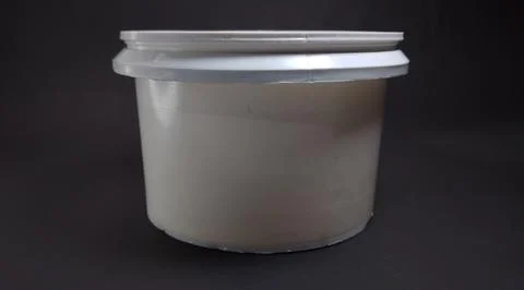 Solid white storage jar, round, black background Stock Photos