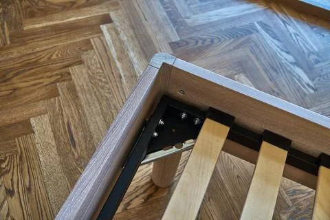 Solid wood bed in modern scandinavian style close-up Stock Photos