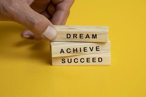 Solid wooden locks on a yellow background Stock Photos