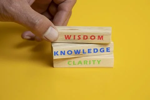 Solid wooden locks on a yellow background Foto stock