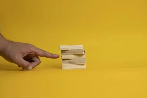 Solid wooden locks on a yellow background Stock Photos