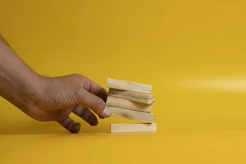 Solid wooden locks on a yellow background Stock Photos