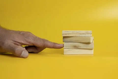 Solid wooden locks on a yellow background Stock Photos