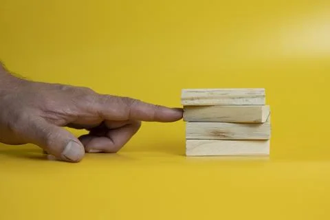 Solid wooden locks on a yellow background Stock Photos