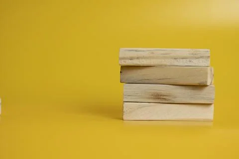 Solid wooden locks on a yellow background Stock Photos