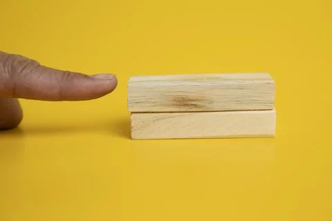 Solid wooden locks on a yellow background Stock Photos