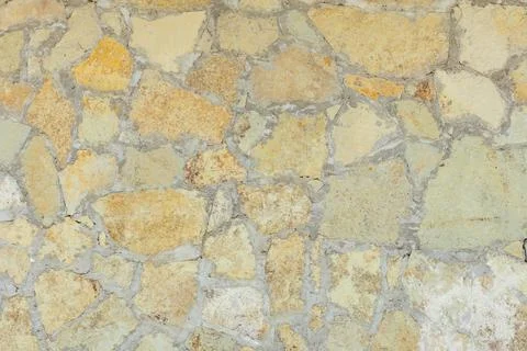 Solid yellow and beige stone wall suitable for background Stock Photos