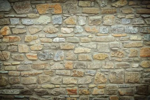 Solid yellow and beige stone wall with vignette, good for background Stock Photos