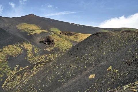 Solidified lava and the slopes of the active volcano Etna Stock Photos