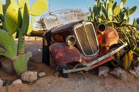Solitaire, Namibia - Jul 12, 2019: Wrecked cars in the desert arround Solitai Stock Photos