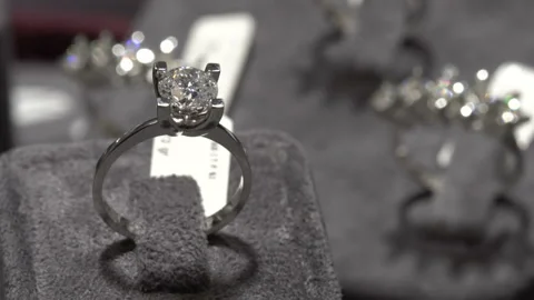 Solitaire ring shine. Diamond ring jewelery macro close up shoot in jeweler Stock Footage 139735588
