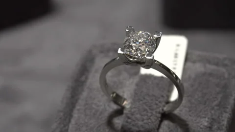 Solitaire ring shine. Diamond ring hand made jewelery macro close up shoot Stock Footage 139735737