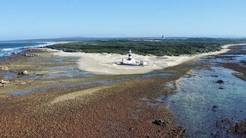 Solitary Beacon Guarding Wind-Swept Coastal Sands Stock Photos
