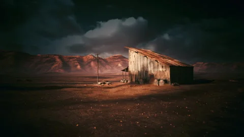 Solitary figures in arid environment facing changing weather conditions Stock Footage 334332997