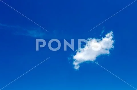 A solitary little cloud crosses the blue sky over the Andean mountains of cen Stock Photos
