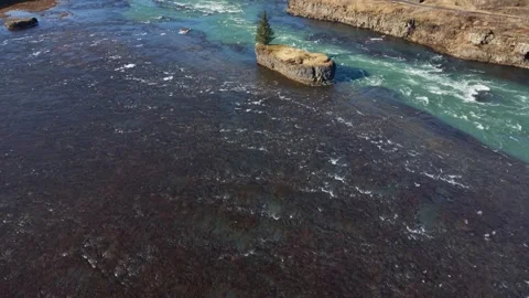 Solitary Pine Tree on Islet in Icelandic Glacial River Rapids - Aerial Drone 4K Stock Footage 331255141