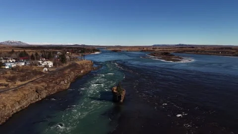 Solitary Pine Tree on Islet in Icelandic Glacial River Rapids - Aerial Drone 4K Stock Footage 331255161