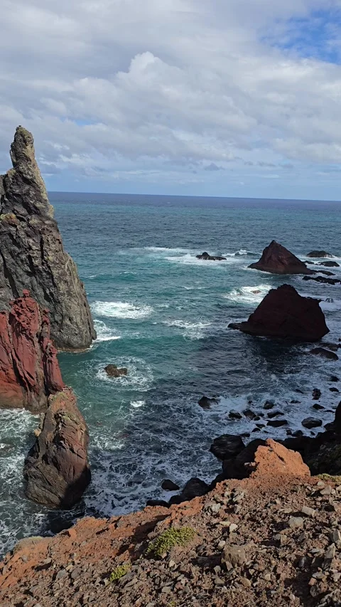 Solitary sea stack off Ribeira da Janela pierces the Atlantic horizon.  Stock Footage 310025340