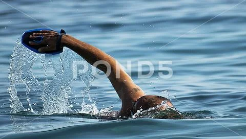 Solitary swimmer in the sea Stock Photos