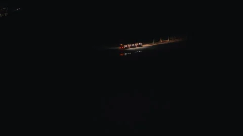 A solitary train light cutting through pitch-black darkness. Stock Footage 299893530