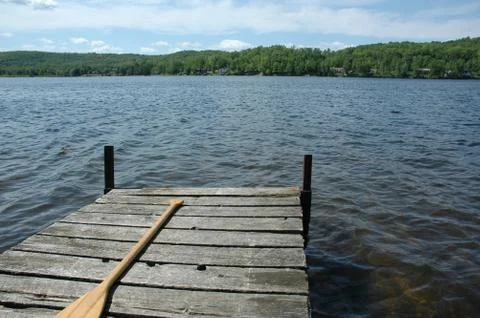 Solitude - cedar dock on a small calm lake 写真素材