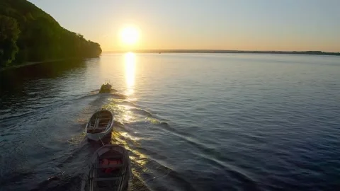 Solitude on the Volga: A Small Boat Drifting Stock Footage 280673290