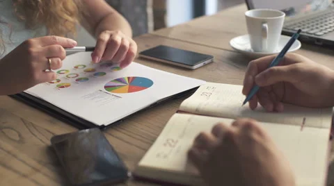 Сolleagues discussing data working and tablet, laptop with on on architectural Stock Footage 67956404