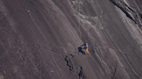 Solo Ascent on the Sheer Monolith Video stock 321100474