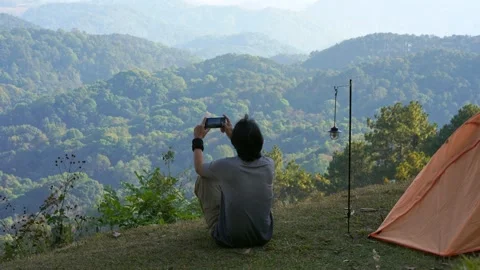 Solo freelancer man camping work outdoor and relax with layer of mountain Stock Footage 270130560
