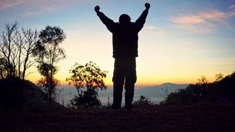 Solo freelancer man stand and see sunrise with layer of mountain background Stock Footage 263183813
