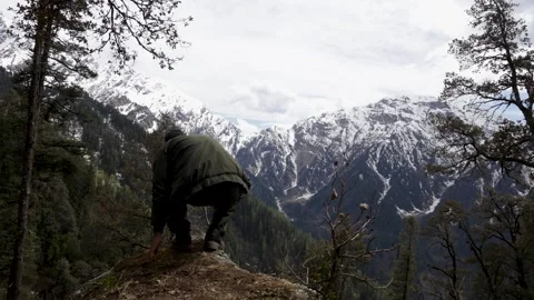 Solo Hiker exploring Snow Covered Peaks From a Himalayan Mountain Ridge Stock Footage 345281370