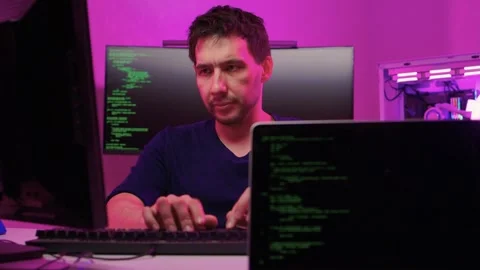 Solo software engineer working through technical issues late at night. Dedicated Stock Footage 347875138