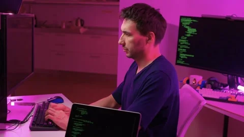 Solo software engineer working through technical issues late at night. Dedicated Stock Footage 347875139