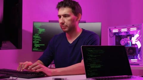 Solo software engineer working through technical issues late at night. Dedicated Stock Footage 347875162