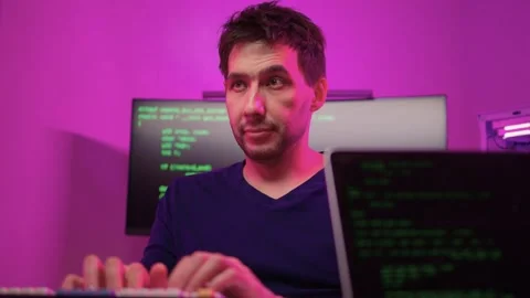 Solo software engineer working through technical issues late at night. Dedicated Stock Footage 347875210