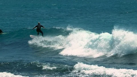 Solo surfer catches a small wave in New South Wales Stock Footage 71941325