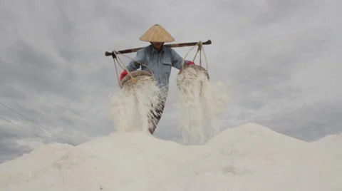 Solo Worker Dumps Salt Atop of a Large Salt Hill 動画素材 42426438
