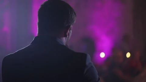 The soloist sings into the microphone, back view Stock Footage 137540285