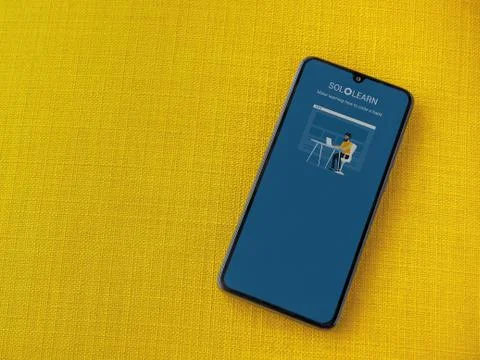 SoloLearn - Learning coding app launch screen with logo on the display of a b Stock Photos