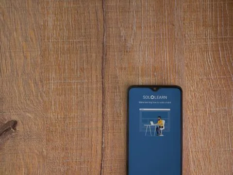 SoloLearn - Learning coding app launch screen with logo on the display of a b Stock Photos