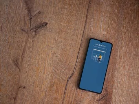 SoloLearn - Learning coding app launch screen with logo on the display of a b Stock Photos