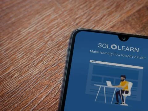 SoloLearn - Learning coding app launch screen with logo on the display of a b Stock Photos